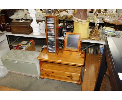 A pine TV stand, a CD rack and CDs, together with a dressing table mirror