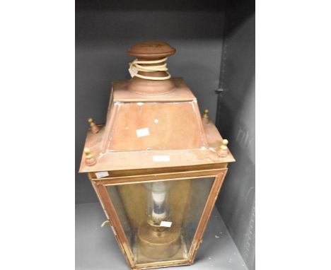 A large copper lantern, of tapering square section form with raised surmount, most likely had a pedestal base at some stage l