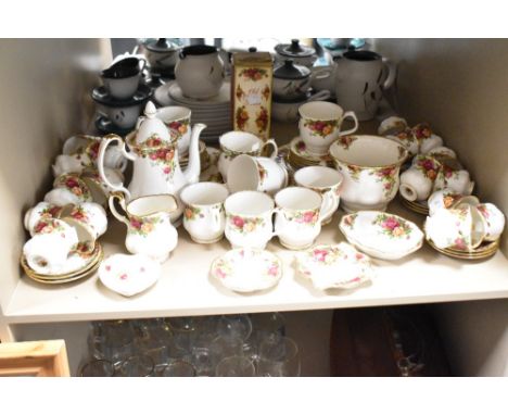 A Royal Albert Old Country Rose pattern part dinner service, decorated with gilt edges and floral designs, to include a heart