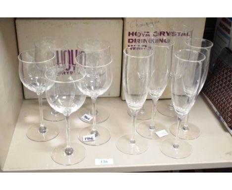 Two boxes containing Hoya crystal glasses, comprising of 5 large wine glasses and 6 champagne flutes