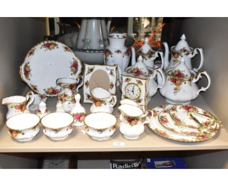 A Royal Albert Old Country Rose pattern part dinner service, decorated with gilt edge and foliage on a white ground, to inclu