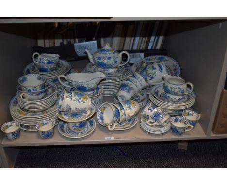 A Masons Regency pattern ironstone dinner/tea service decorated with blue, yellow and red foliage on a cream ground, to inclu