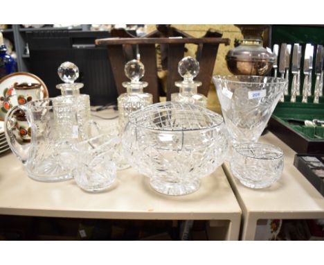 A 20th century Briard clear cut crystal glass vase, having footed conical body cut with floral patterns and abstract repeat d