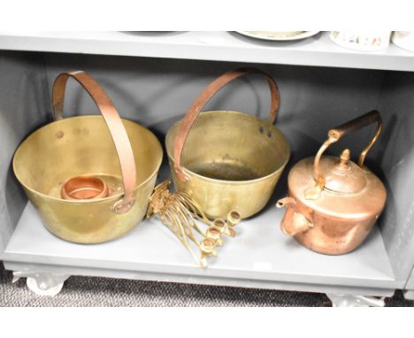 A pair of brass jam pans, w30cm, sold together with a copper kettle and two candle sconces, (5)