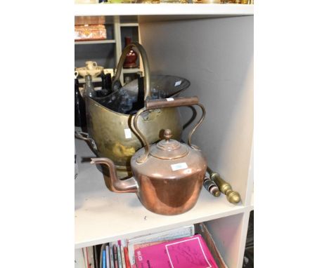 A large copper coal helmet having shaped handle, h40cm, sold together with a copper kettle and two fire brasses, (4)