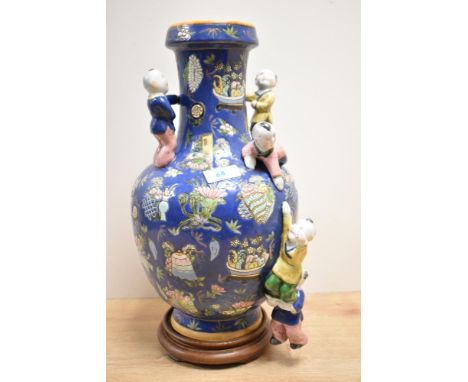 A Chinese famille rose porcelain Qing dynasty style five-boys blue ground fertility vase, of traditional shape decorated with