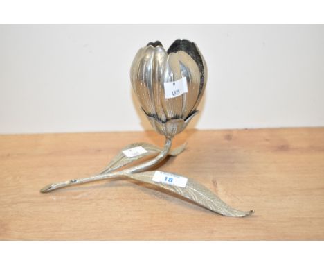 A vintage eastern cast white metal lotus flower ashtray stand, having six removable petal form ashtrays housed within the flo