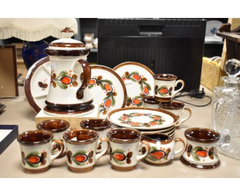 An attractive 1970's German Schramberg pottery Bernau pattern part coffee service, decorated in browns, greens and orange wit