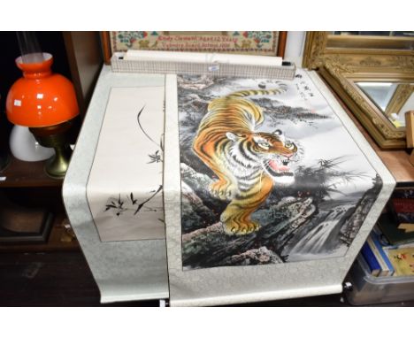 A Chinese scroll depicting a tiger by a waterfall, signed upper right, L123cm, sold together with two other scrolls, (3)