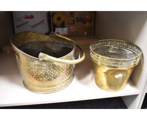 A late 19th / early 20th brass coal helmet, h23cm, sold together with a brass planter, (2)