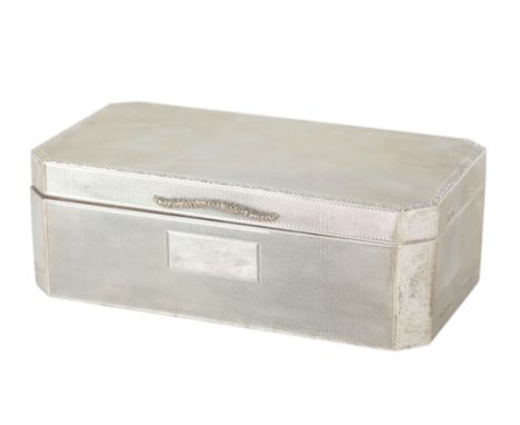 A GEORGE V SILVER RECTANGULAR CIGARETTE BOX by Beddoes &amp; Co, Birmingham 1929, with scrolled border, shaped thumbpiece and