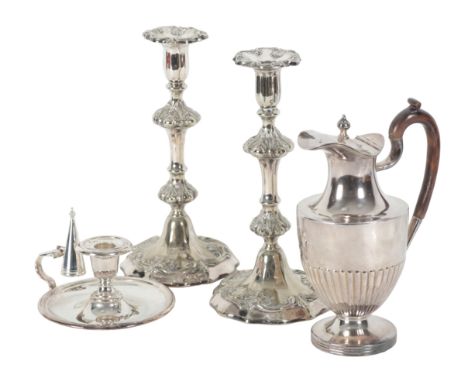 A PAIR OF LATE 19TH CENTURY SILVER PLATED PILLAR CANDLESTICKS with leaf mouldings, double knopped stems, on shaped loaded bas