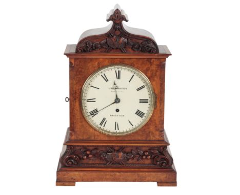 A VICTORIAN WALNUT MANTLE CLOCK the 19cm painted dial, inscribed " Lawson &amp; Son Old Steine Brighton", with single fusee m