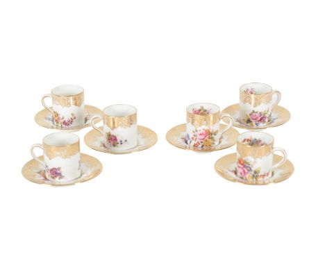 A HAMMERSLEY BONE CHINA PART COFFEE SERVICE enamelled with rose garlands and with gilded rims, comprising six coffee cans and