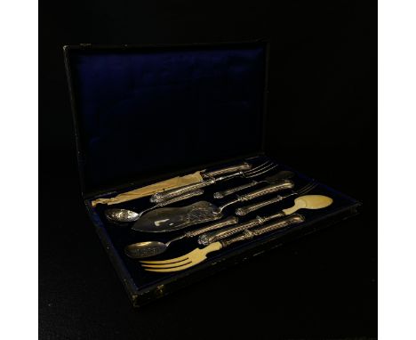 A 19th century French hallmarked silver carving and serving set with ivory fork and spoon heads, a steel bladed knife and two