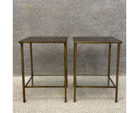 A pair of 20th century side or lamp tables each having a rectangular smoked glass top set into a distressed gilt metal frame 