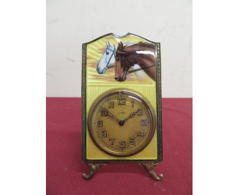 Enamel and silver gilt faced 8 day mantel clock with pair of horses heads on yellow enamel background with easel stand, rever