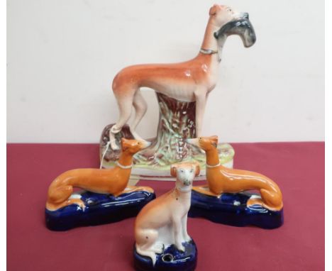 Large Victorian Staffordshire model of a greyhound with a fallen hare, on a natural base (H29cm); pair of Staffordshire model