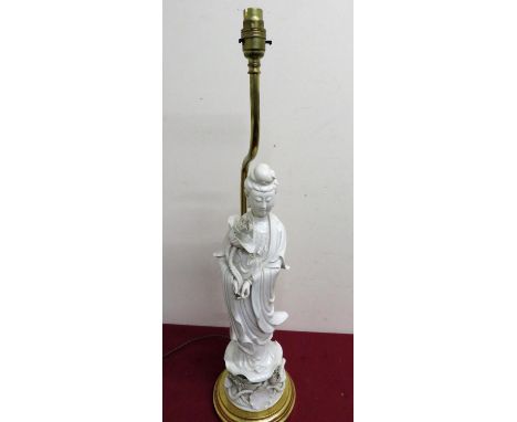 Chinese Blanc de Chine figure of a female deity with articulated hand, mounted on a gilt wood and brass table lamp base (over