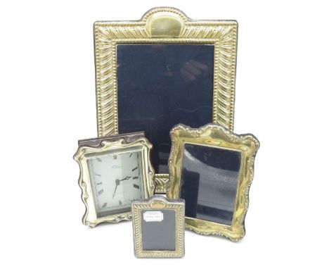 Silver hallmarked rectangular easel picture frame (26cm x19cm), a similar smaller frame (14cm x 11cm), another smaller frame 