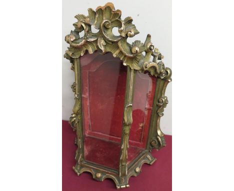 A carved and gilt wood framed table top bijouterie cabinet, with single interior shelf, rear opening door and velvet lining. 