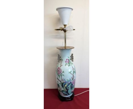 Large Chinese famille rose style table lamp with twin gilt handles and main body decorated with exotic birds and floral detai