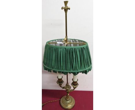 A gilt cast metal twin branch table lamp with adjustable height shade and circular base. (H70cm) 