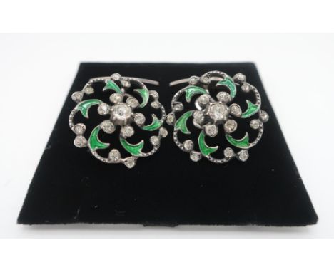 Pair of unmarked paste and green enamel openwork buttons, now with silver stamped oval backs (2) 