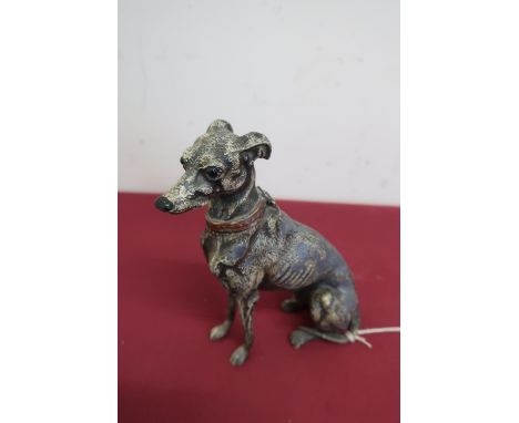 Late Victorian painted cast Spelter table cigarette lighter in the form of a seated greyhound, hinged lifting head with black
