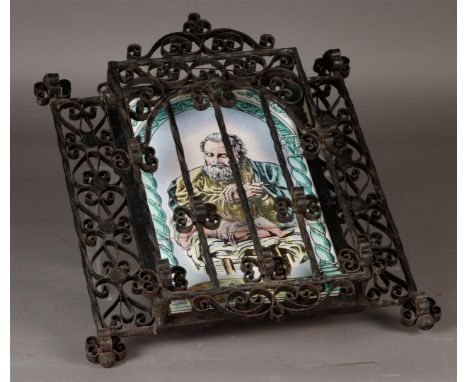 A tile panel depicting San Jose (St. Joseph) with a child in a wrought iron frame. Spain, 20th century.Afm.: 40 x 35 cm.