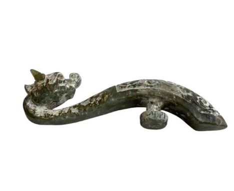 Chinese green jade belt hook in the shape of a dragon, 10cm length.