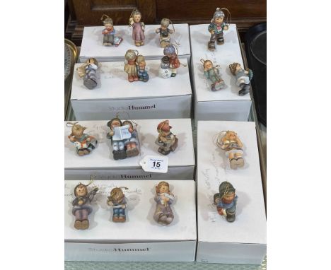 Seventeen Studio Hummel figures.