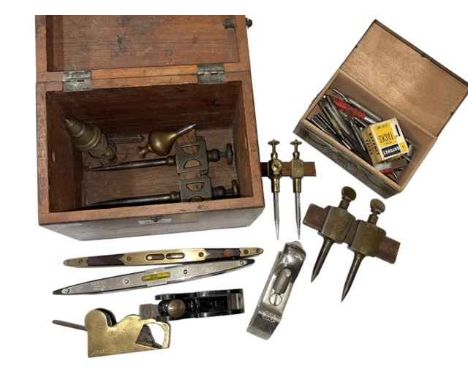 Box of vintage tools including levels, small planes, etc.