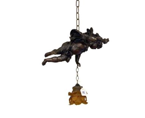 Cherub hanging light fitting with amber glass shade.