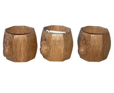 Three Robert Thompson of Kilburn 'Mouseman' octagonal napkin rings.