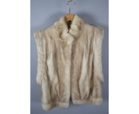 A Vintage Ladies Sleeveless Fur Jacket 