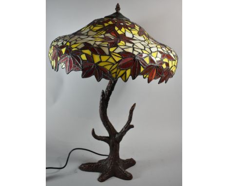 A Reproduction Cast Metal Based Tiffany Style Table Lamp, The Support in the The form of a Tree Trunk, 65cms High 