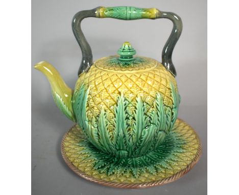A 19th Century Majolica Teapot and Stand Modelled in the Form of a Pineapple, 17cm high (Hairline to handle and Loss to Inner