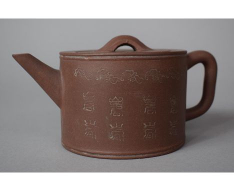 A Yixing (Purple CLay) Teapot decorated with Character Marks and Scrolls, Seal Marks to Base, 7.5cms High 