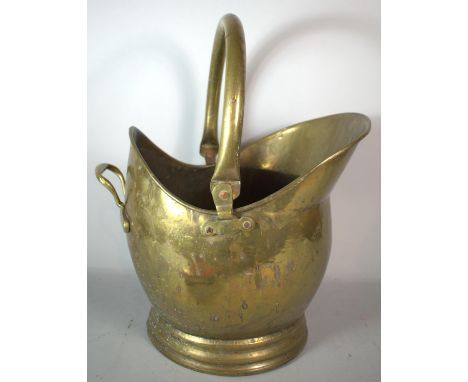 A Brass Helmet Shaped Coal Scuttle, 46cm high 