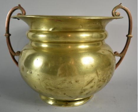 An Arts and Crafts Influenced Brass Planter with Copper Handles by William Souter and Sons, 24cms Diameter 