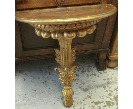 Wooden gilded demi lune fluted and foliate carved console table.(B.P. 24% incl. VAT)   CONDITION REPORT:  No marble top.  Min