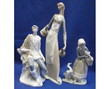 Nao porcelain figurine of a slender girl water carrier, with impressed marks. Together with another Lladro porcelain figure o