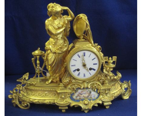 19th Century French Ormolu figural mantel clock, having Roman white enamel face over inset French porcelain painted cherub pa