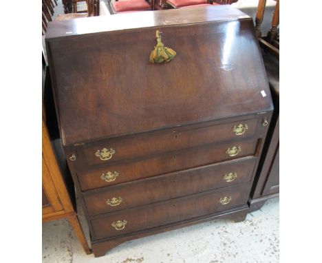 Late 19th/early 20th Century mahogany fall front bureau, having four long drawers on bracket feet. (B.P. 24% incl. VAT)