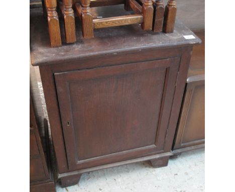 Stained pine blind panelled cupboard, the interior revealing single shelf on bracket feet. (B.P. 24% incl. VAT)