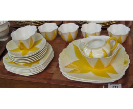22 piece Shelley china fluted yellow and white tea service, registration no. 272101.(B.P. 24% incl. VAT)