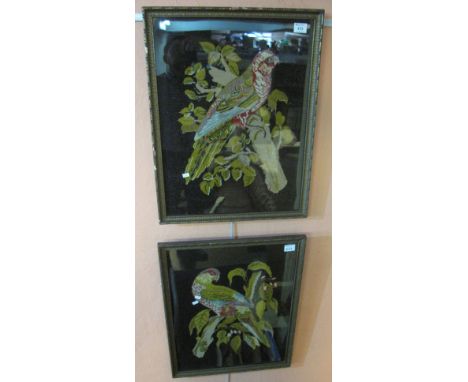 Two large Berlin woolwork type tapestry panels depicting parrots amongst foliage, 60 x 46cm.  Framed and glazed. (2)(B.P. 24%