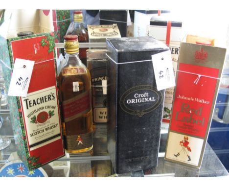 Five bottles of Scotch Whisky to include: Johnnie Walker Red Label (unboxed, shoulder level); Teacher's Highland Cream Perfec