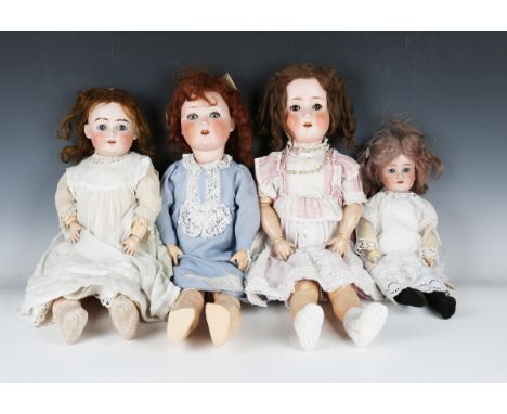 A Schoenau &amp; Hoffmeister bisque head doll, impressed '1909 6½, with later brown wig, sleeping blue eyes, open mouth showi